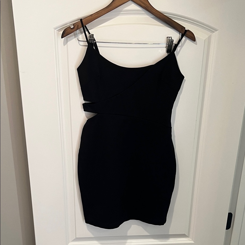 Guess cocktail dress with side cutouts and adjustable straps.